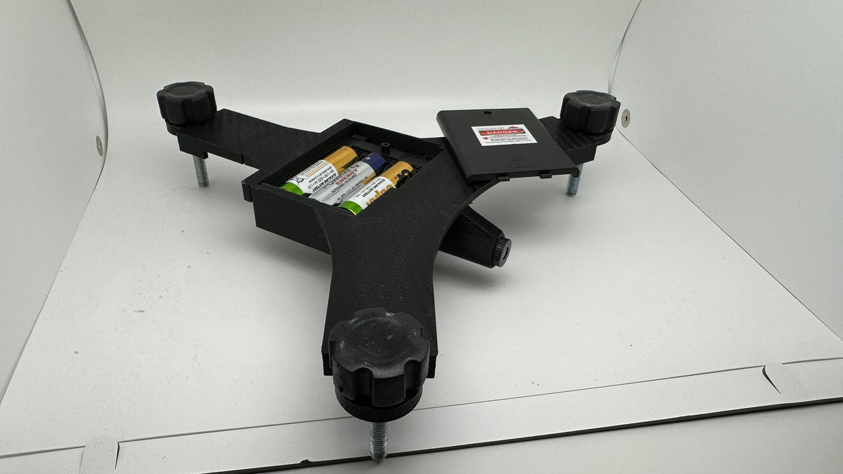 Underside of an assembled Rapsodo MLM2PRO stand with battery compartment open