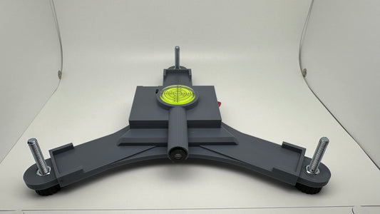 Front view of the Rapsodo MLM2PRO rechargeable stand with yellow bubble level