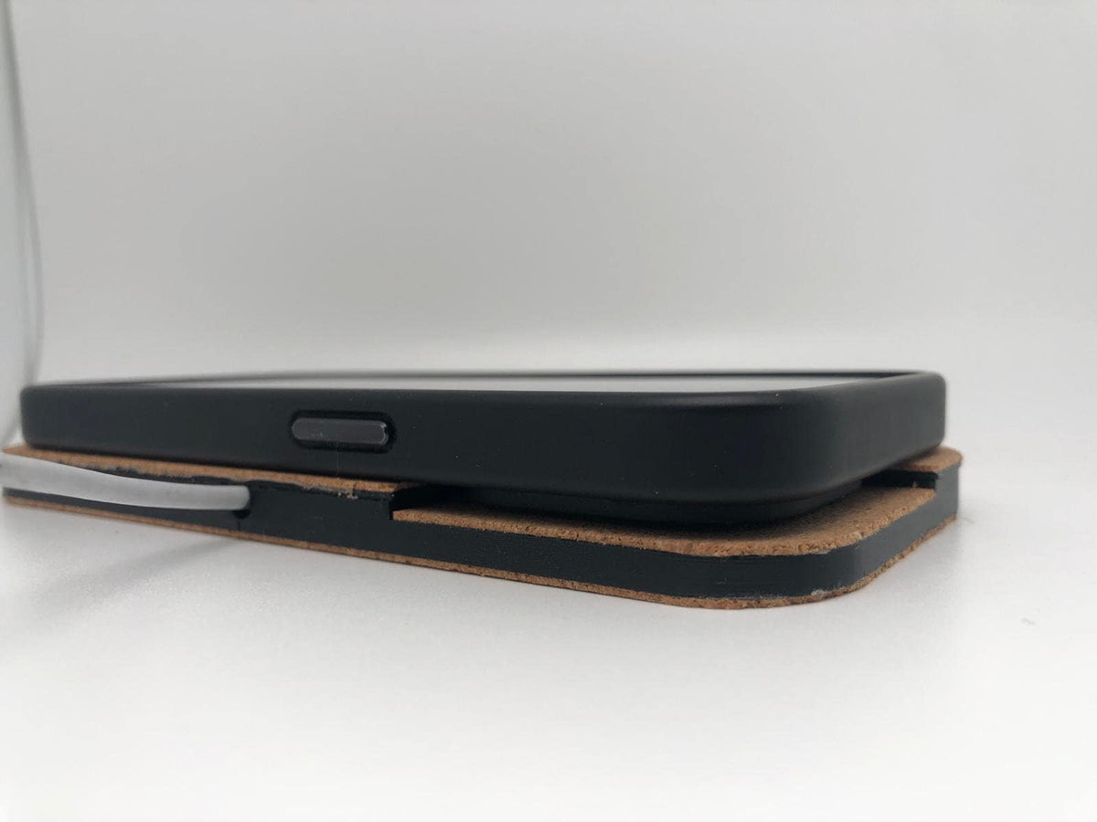 Side view of the phone and black wireless charger housing