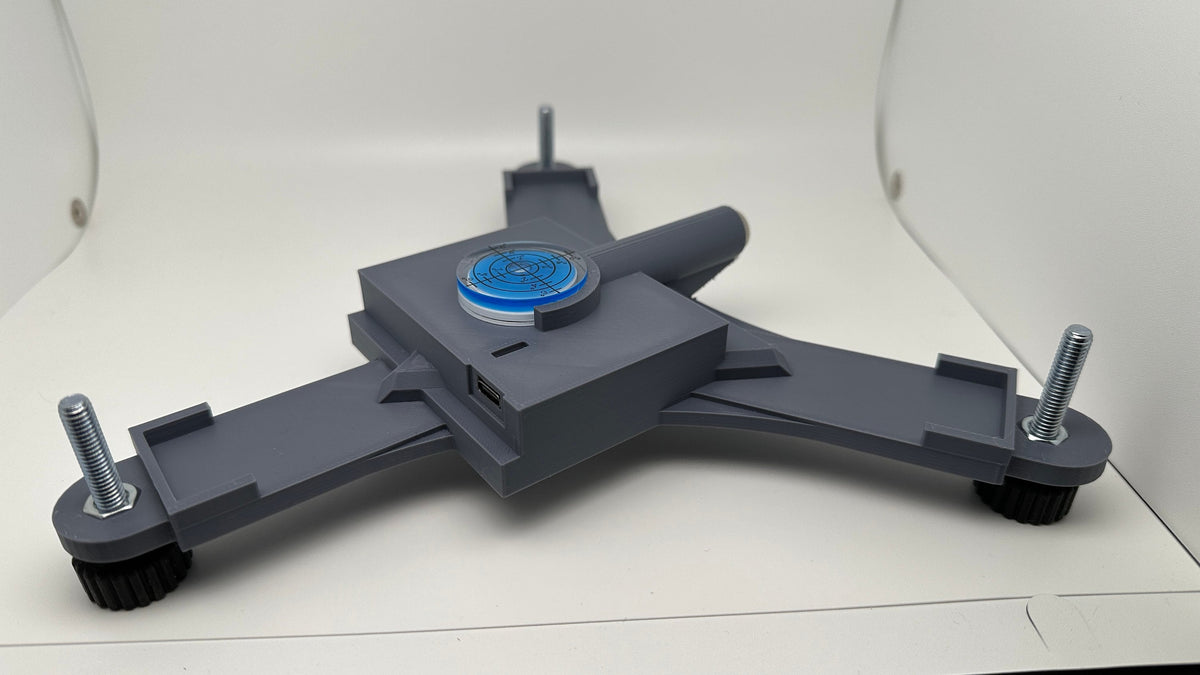 Side view of the Rapsodo MLM2PRO rechargeable stand and three leveling feet